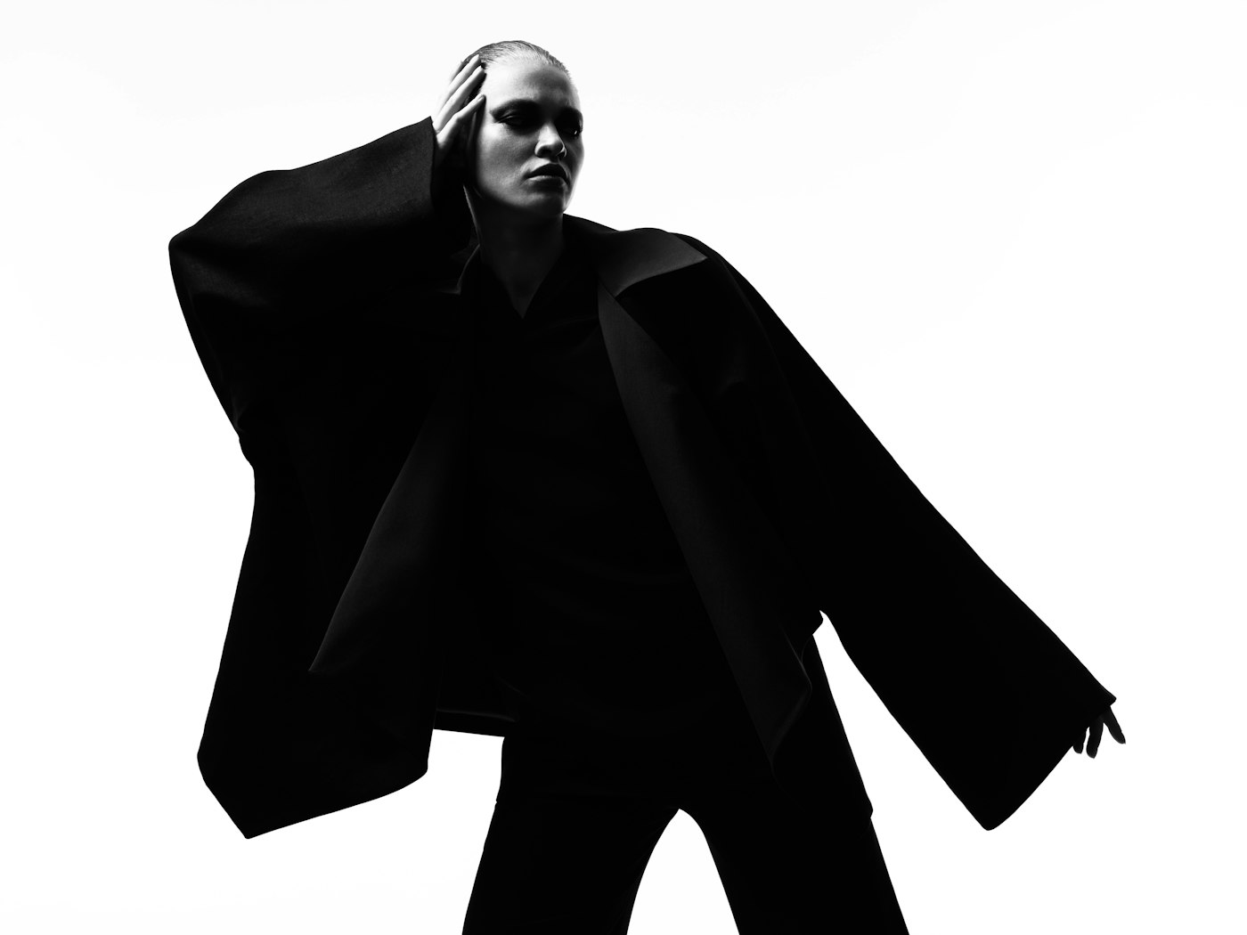Model walking in an oversized coat